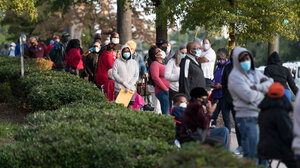 Voters waiting in long lines to cast their ballot.