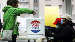 Woman casts a ballot in a New York City election.