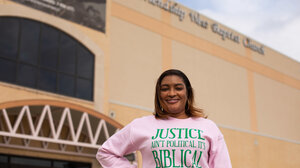 Pastor Danielle Ayers stands in front of Friendship-West Baptist Church