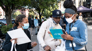 Census volunteers interview a person