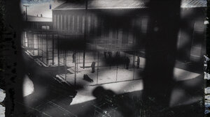 View of a prison yard through a barred window