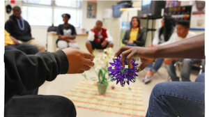 Teens sit in on a group counseling session.