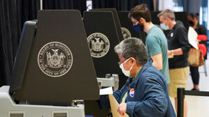 Woman casting a ballot in a New York election