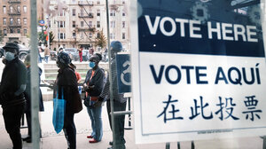 Citizens wait in line to vote