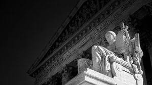 Close-up black and white image of Supreme Court