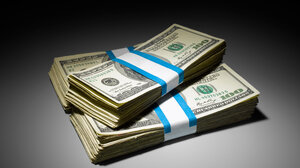 Three stacks of $100 dollar bills