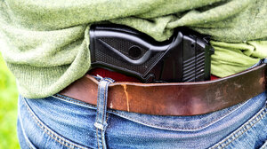 A handgun tucked into a belt