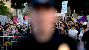 Abortion protest and police officer