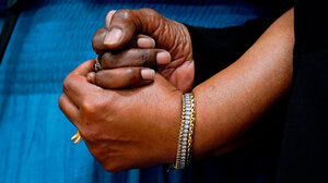 Hands clasped in support