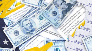 Money lying on top of words about election denial