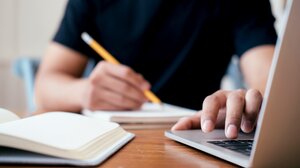 Teen looking at laptop