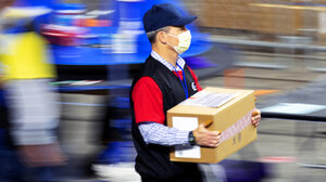 A man carrying a ballot box