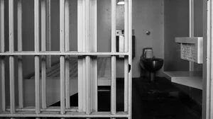 Black and white image of jail cell