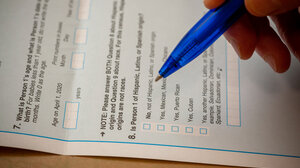 Person filling out race question on census form