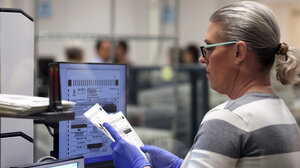 Person reviewing ballot