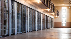 Row of prison cells with bars