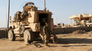 US troop carrier and soldier in Iraq
