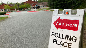 Sign pointing to a polling place