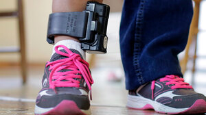 Person wearing ankle monitor