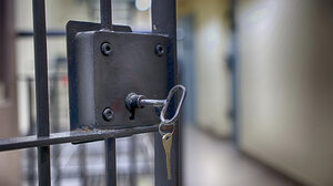 Jail cell with key in the lock