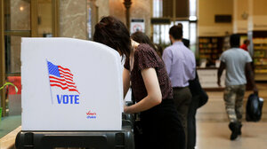 Voter in booth