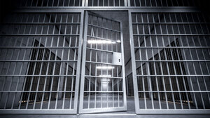 Black and White image of door to jail cells