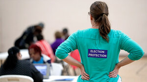 Poll watcher at a polling place