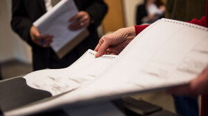 someone holding a ballot