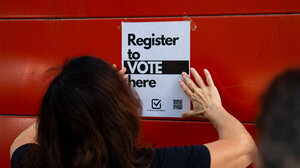 A register to vote sign.