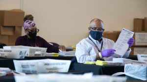 image of Georgia election officials counting ballots