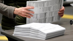Stack of paper ballots