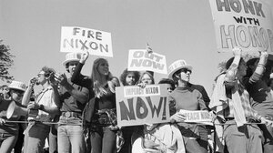 Protesters holding anti-Nixon signs in 1974