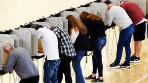 Voters in voting booths