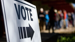 Voting sign and voters