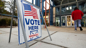 "Vote here" sign outside a polling place