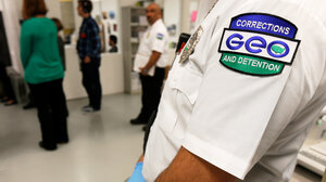 GEO Group logo on sleeve in foreground