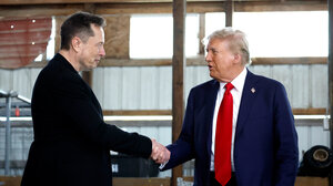 Elon Musk shaking hands with Donald Trump