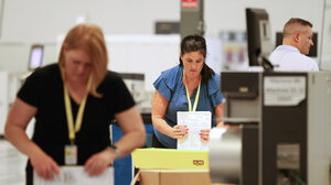 Election workers doing their jobs