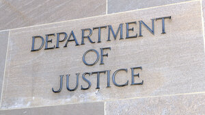 Department of Justice lettering on gray building