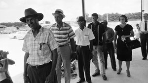 Voters wait in line to apply for registration in Buras, Louisiana.