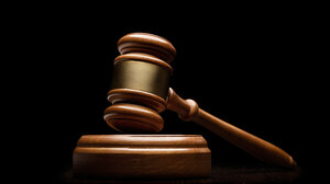wood gavel against black background