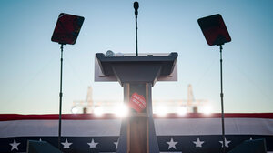 Podium with a MAGA hat