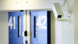 interior of jail with camera and cell doors