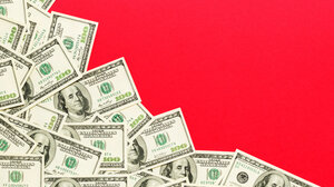 Illustration of spread of cash on red background