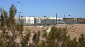 prison and fence with plants in foreground