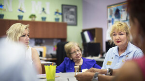 Three women sitting at a table