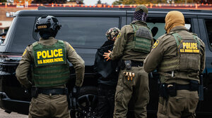 Border Patrol agents conduct an arrest in Chicago.