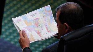 Texas district map in lawmker's hands