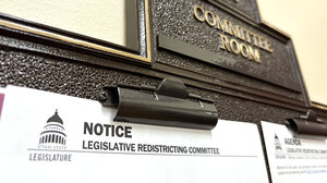 A notice announces a redistricting hearing at the Utah State Legislature.