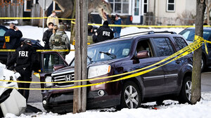 Car of R. Good surrounded by police tape